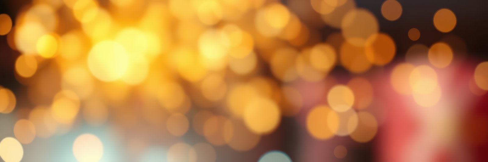 Colorful bokeh lights create a festive atmosphere at a lively celebration during the evening
